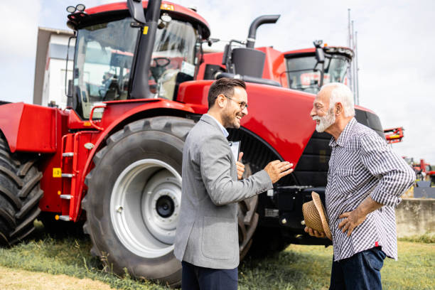 istock Salesman selling agricultural machines. 1729622082
