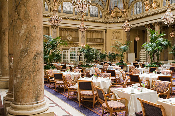 Luxurious restaurant with white tablecloth and marble pillar