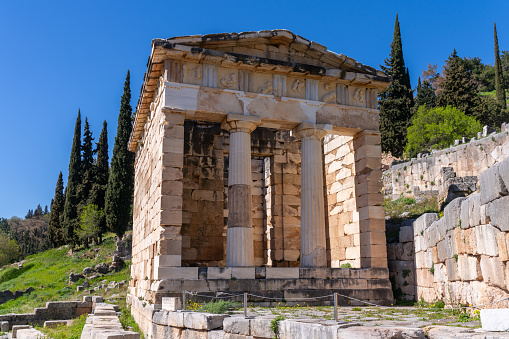 Delphi, Greece - 14 March 2023 -The Athenian Treasury on the Delphi site