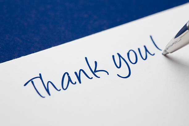 In the process of writing a thank you card.   See also: 