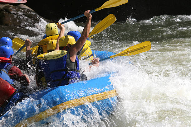 Boaters having a big time on a whitewater weekend. 