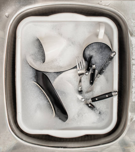 istock Dirty Dishes In Sink 1729631903