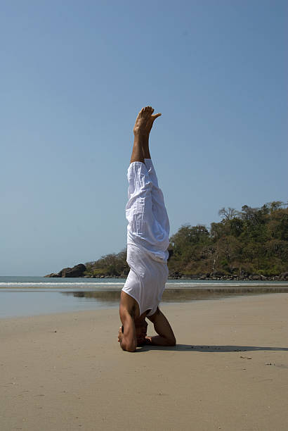 Headstand in white stock photo