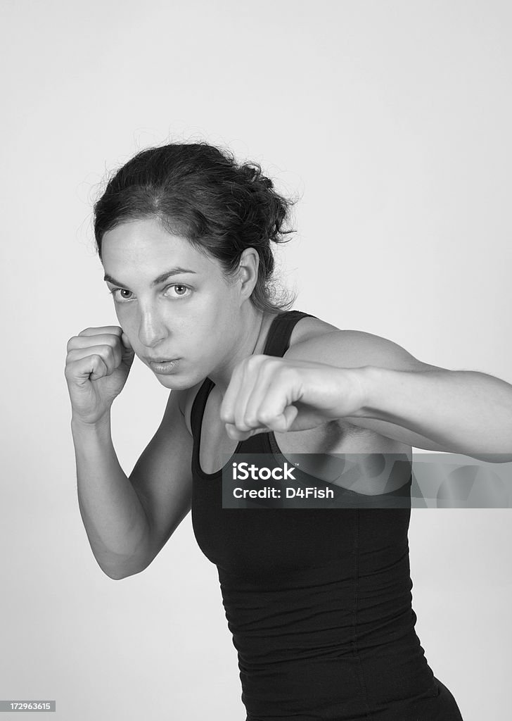 Martial Arts "A Young Woman Practicing Martial Arts In Black and White. Copy Space. (GTALyspe, Toronto)Click here for more" 20-29 Years Stock Photo