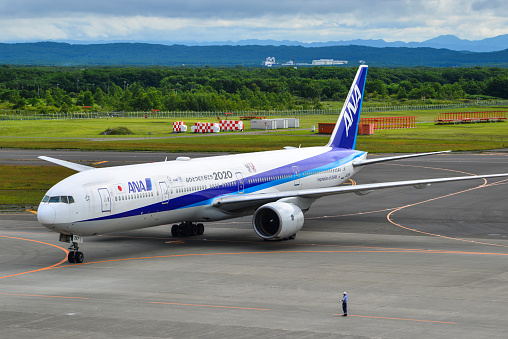 Sapporo, Japan - Jul 3, 2019. JA757A All Nippon Airways (ANA) Boeing 777-300 taxiing on runway of New Chitose Airport (CTS) in Sapporo, Japan.