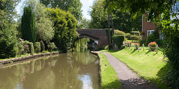 istock cottage house alongside canal 172963863