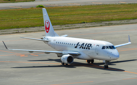 Sapporo, Japan - Jul 3, 2019. JA221J J-Air Embraer ERJ-170STD taxiing on runway of New Chitose Airport (CTS) in Sapporo, Japan.