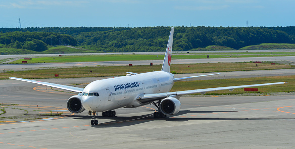 Sapporo, Japan - Jul 3, 2019. JA751J Japan Airlines Boeing 777-300 taxiing on runway of New Chitose Airport (CTS) in Sapporo, Japan.