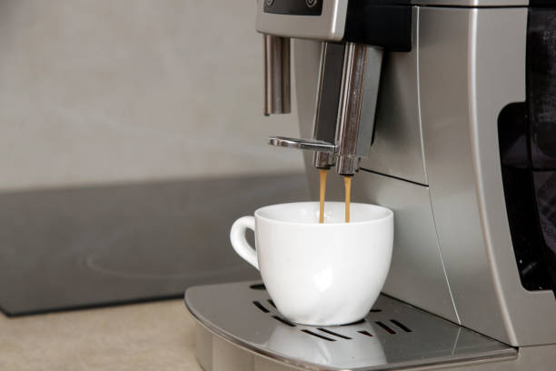 istock Beautiful woman having her first morning coffee in the kitchen 1729646827