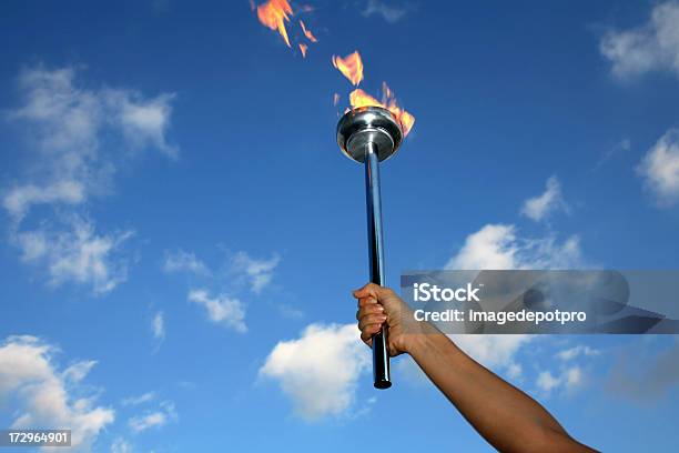 Glory Of Holding Flaming Torch Stock Photo - Download Image Now - International Multi-Sport Event, Flaming Torch, Flame