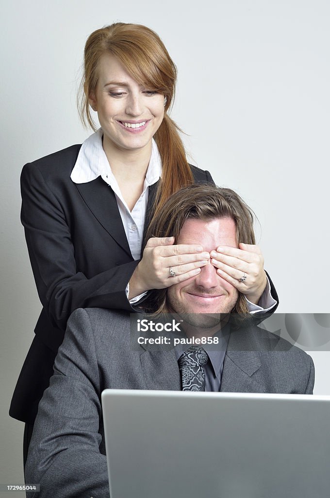 Having Fun Young professionals playing with a laptop.See more of my people images: Adult Stock Photo