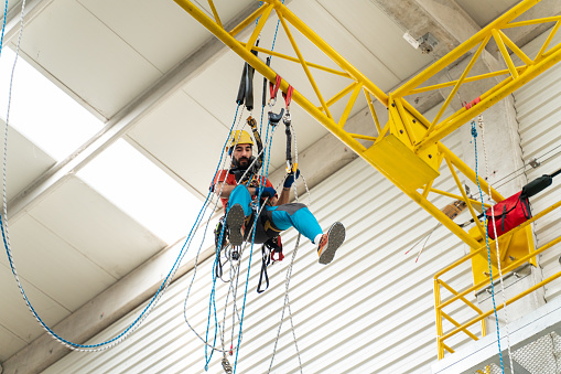 Rope access technician climbing