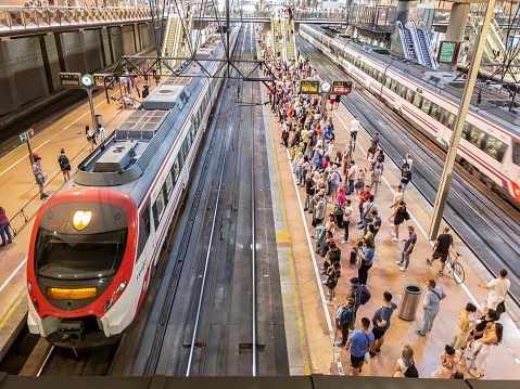 Madrid, Spain - October 7, 2023. People waiting a Cercanias train in Atocha Cercanías Train station. Madrid, Spain.