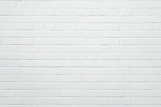 brick wall A blank white mediterranean brick wall with copy space.Photographed in Spain. brick stock pictures, royalty-free photos & images