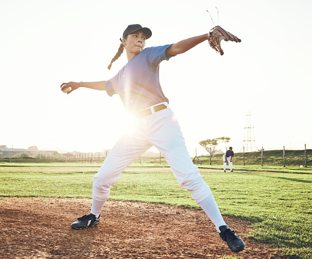 Left-handed fastpitch softball pitcher:  Girl (9 years) on mound.  Image shot from second base position looking in toward the plate.