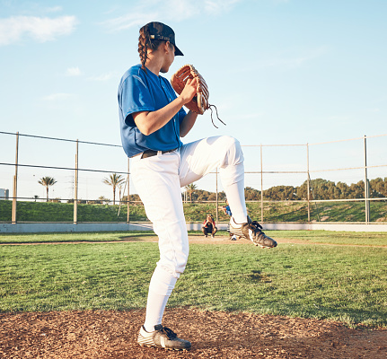 Sports person, pitching and baseball outdoor on pitch for performance and competition. Behind professional athlete or softball player for team game, training or exercise challenge at field or stadium