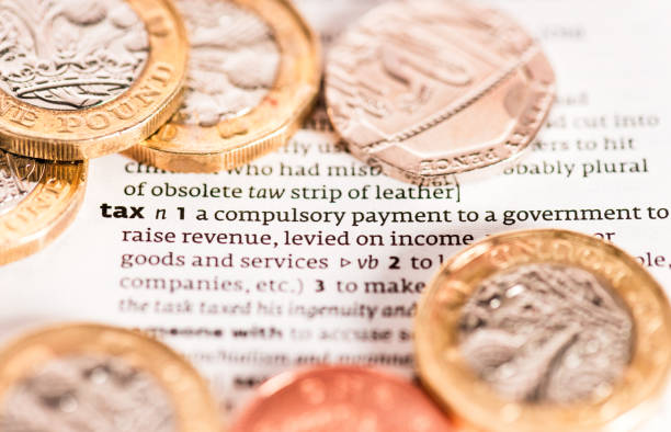 Money: Dictionary Close-up. Selective focus and Canon EOS 5D Mark II with MP-E 65mm macro lens.