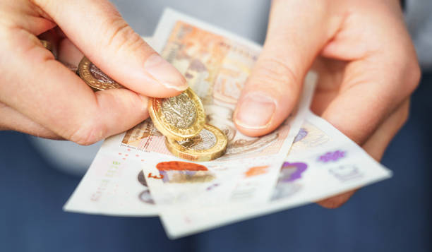 istock Counting cash for payment 1729659269
