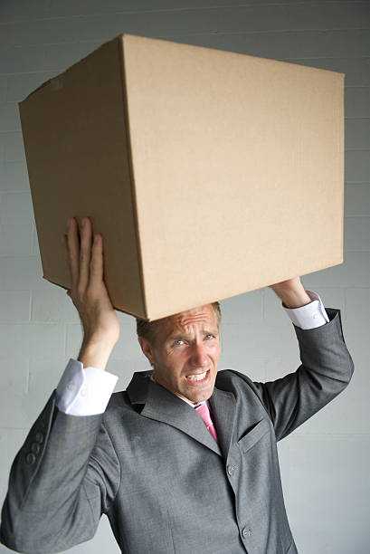 istock Businessman Carries a Heavy Box 172966043