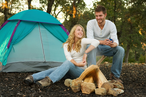 Young couple tent camping in the wilderness.