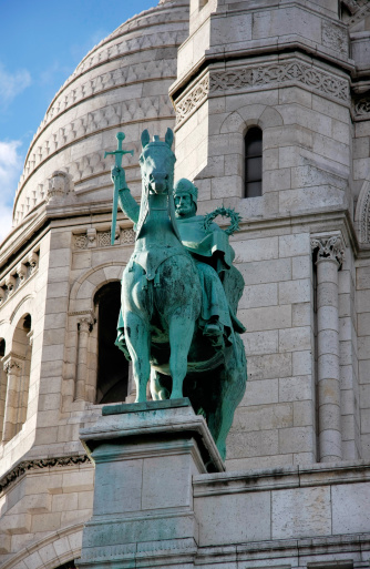 Bronze staue at Bazilica of the Sacre Coeur in Paris, France.