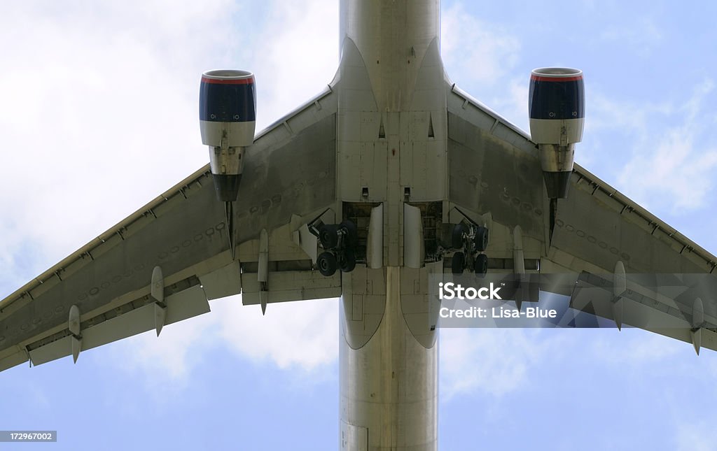 Airplane Flying just after the take off. Pilot is pulling in the undercarriage. Air Vehicle Stock Photo