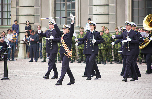 Stockholm, Sweden - June 13, 2008: Military wind orchestra with unidentified musicians at the courtyard of Stockholm Royal Palace during the changing of the Royal Guards ceremony.