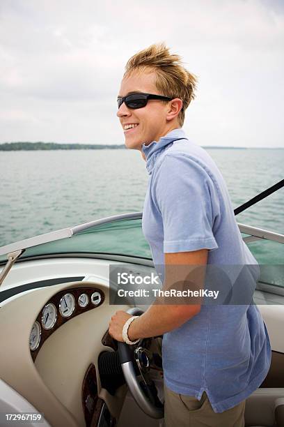 Young Man Boating Stock Photo - Download Image Now - Activity, Adult, Cheerful