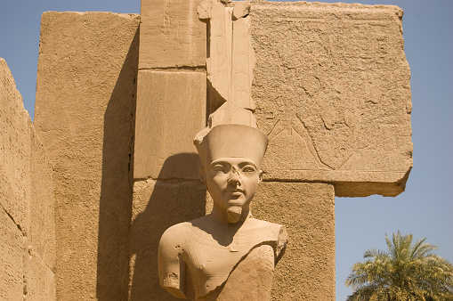 A stone statue of the bird representing Horus at the entrance to the temple of Edfu in Egypt.