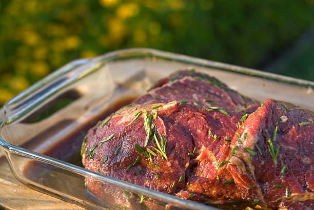 Beef Rib Eye Steaks, Raw Meat & Rosemary Marinade & Barbeque Cooking "Rib eye beef steaks marinated in fresh rosemary herb marinade in preparation for grill!ing. (SEE LIGHTBOXES BELOW for many more barbeque meat dinners, picnic meals, summer cooking & food photos...)" marinated photos stock pictures, royalty-free photos & images