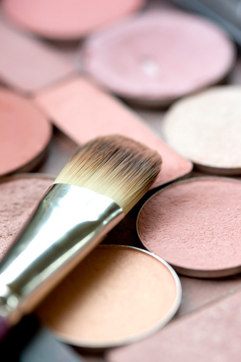Vertical image of eye shadow and brush. Beauty. XXL file available.