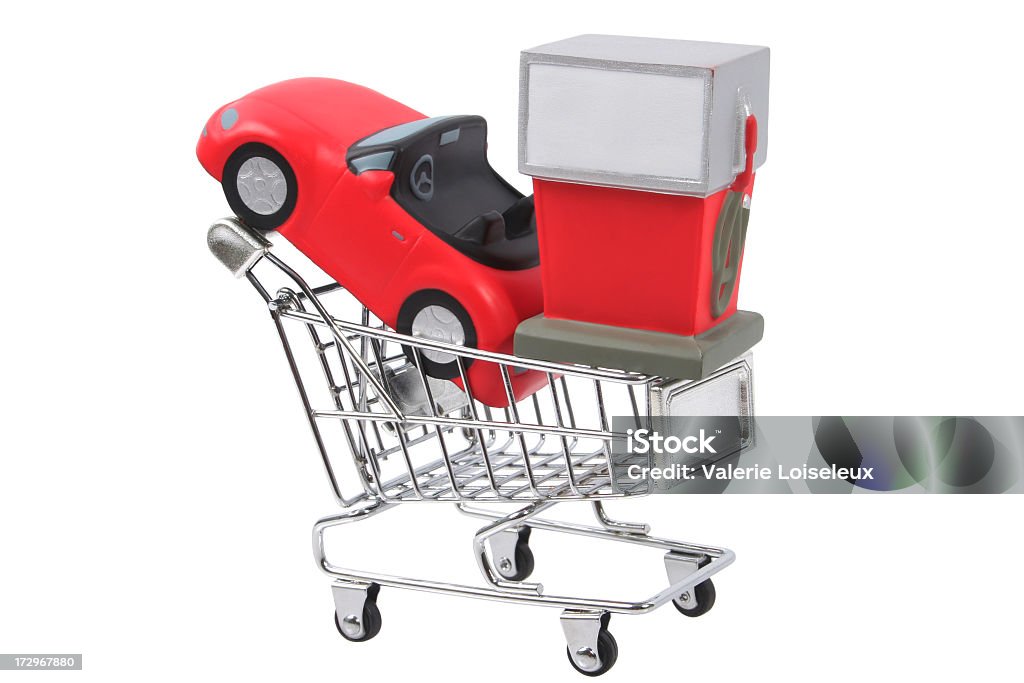 Gas concept Gas concept with car stress ball and Gas pump stress ball in a Shopping Cart. Car Stock Photo