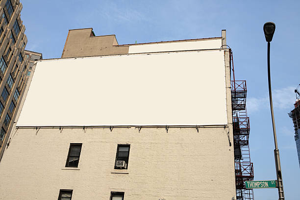 Soho billboard Billboard on Thompson street in Soho NYC soho billboard stock pictures, royalty-free photos & images