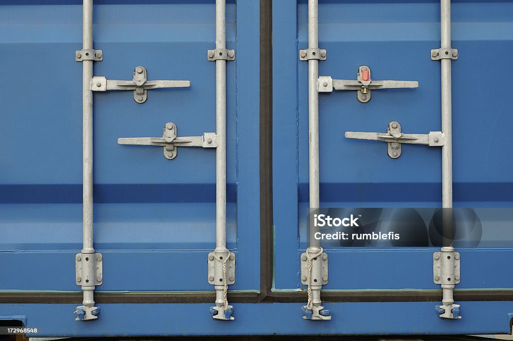 Container door latch A blue cargo container door latch with a security tag. Cargo Container Stock Photo