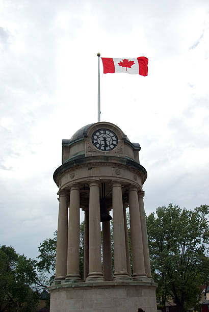 Clock Tower The Canadian Flag flies atop the clock tower in Kitchener's Victoria Park.Similar Images: victoria day canada photos stock pictures, royalty-free photos & images