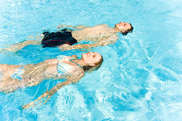 istock young couple in the pool 172968661