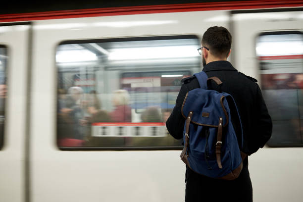istock Young man standing in front of subway train 1729687585