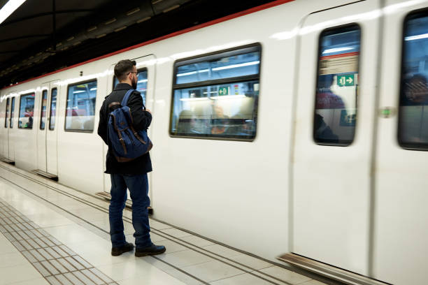 istock Young man standing in front of subway train 1729687588
