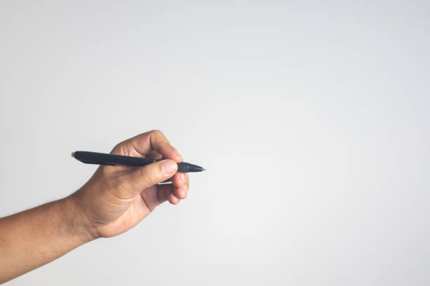 istock The man is gripping a pen to write something on a white background. 1729695278