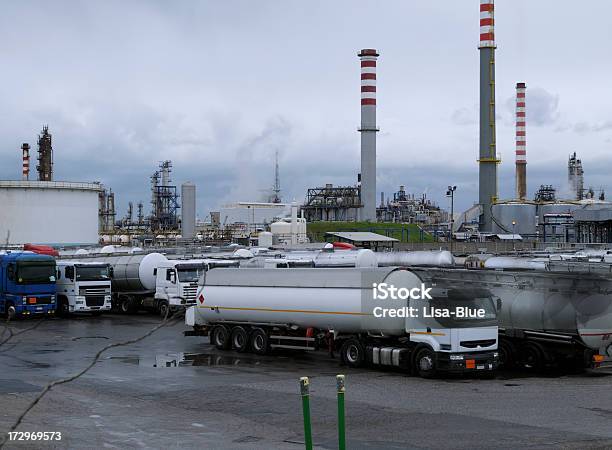 Trucks And Oil Refinery Stock Photo - Download Image Now - Truck, Chemical Plant, Factory