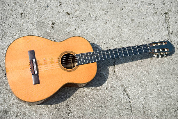 istock Clasic guitar on the concrete 172969774