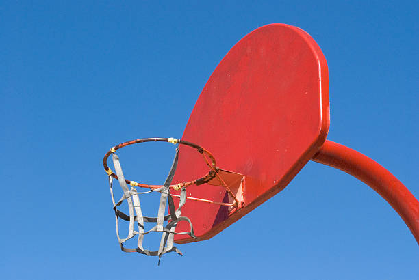 istock Red basketball goal against a clear blue sky. 172969847