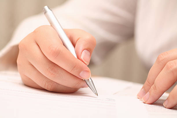 istock Businesswoman viewing the contract before signing 172970662