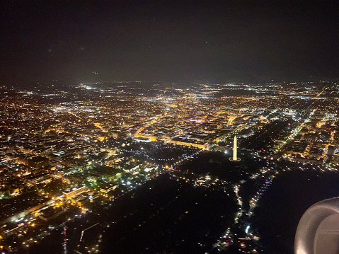 Footage from a plane taking off from Reagan National Airport at night.