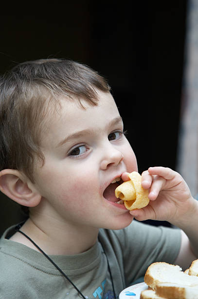 istock Cute 3 year old boy eating 172971179