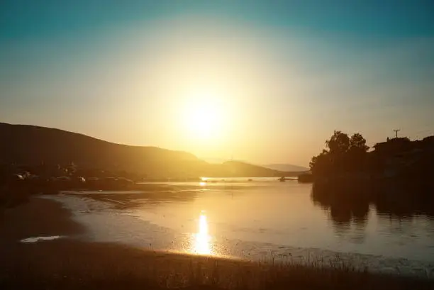 Sunset in Porto Rafti seabay in Greece.