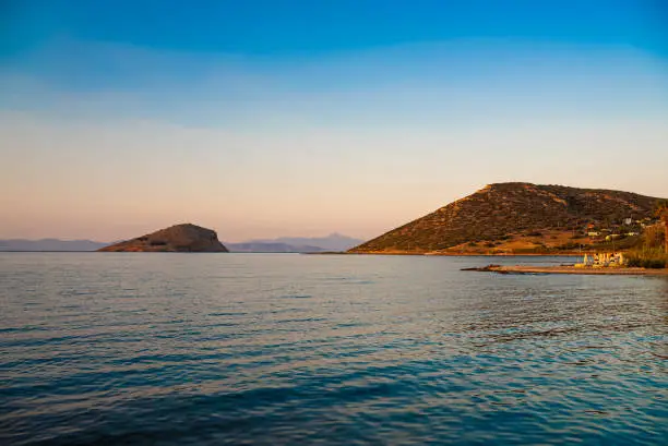 View of seabay with island in Porto Rafti in Greece.