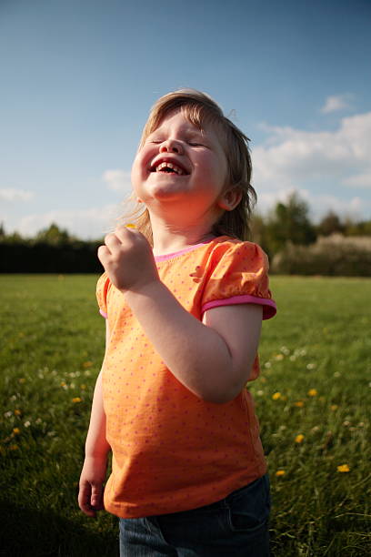 istock Child with Buttercup in Meadow 172971812
