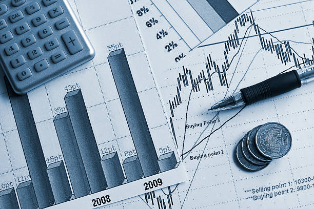 Graphical representations of financial figures with pen stock photo