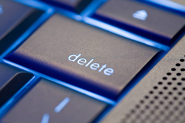 Focus on Delete Sharp focus on delete key of modern, silver computer keyboard computer key photos stock pictures, royalty-free photos & images